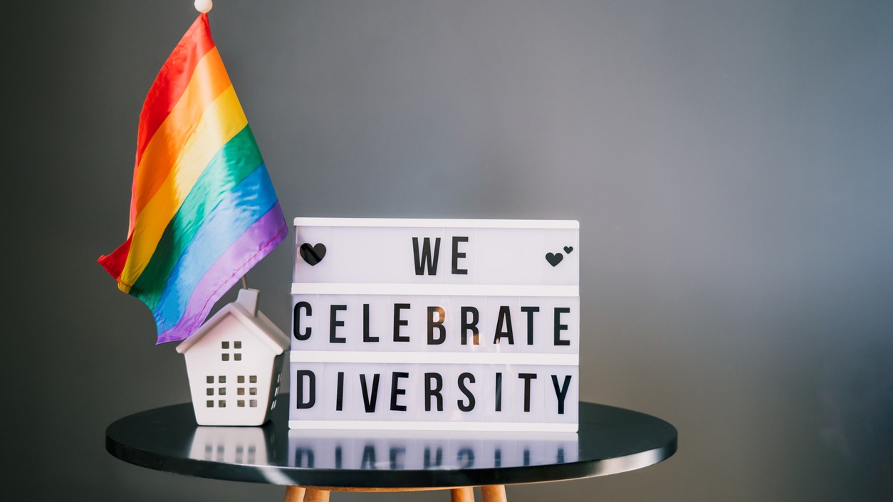 sign on a table reading we celebrate diversity 